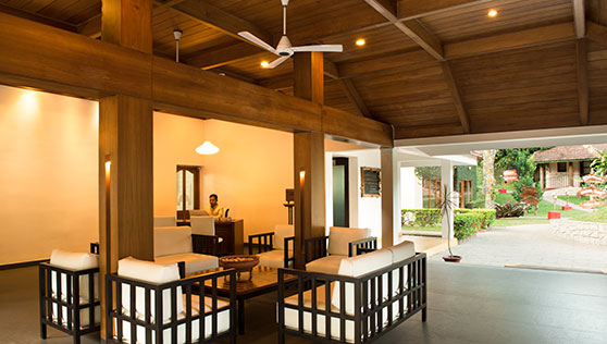 Reception with friendly seating and open plan design at Cardmom County Thekkady India